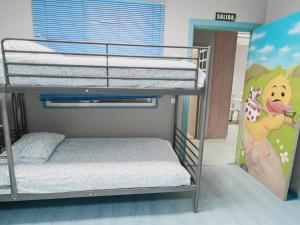 Łóżko lub łóżka w pokoju w obiekcie Hostel Las Rosas