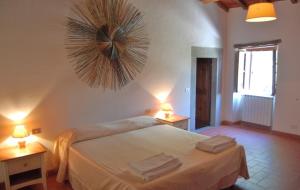 Ένα ή περισσότερα κρεβάτια σε δωμάτιο στο Agriturismo Il Giardino +73 φωτογραφίες