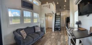 a living room and kitchen of a tiny house at Piney River Resort in Bon Aqua