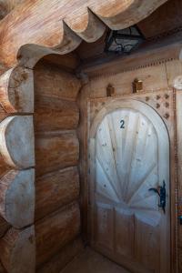 a wooden door with the number on it at Willa Rajka in Zakopane +53 photos