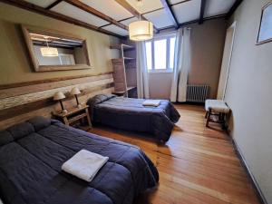 Postel nebo postele na pokoji v ubytování Bariloche Hostel