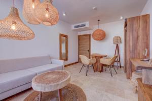 a living room with a couch and a table at La Boheme - Adults Only in Obzor