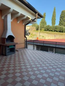 a patio with an outdoor oven on a building at Terrazza House in Palazzolo