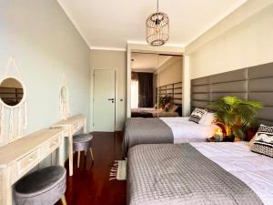 En eller flere senge i et værelse på Sunset Beach Guest House