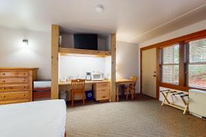 a bedroom with a bunk bed and a desk with a microwave at Seventh Mountain Resort Unit 1914 in Bend +29 photos