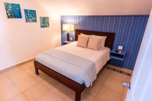 Postelja oz. postelje v sobi nastanitve Tropical Suites Hotel