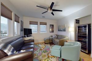 a living room with a couch and a ceiling fan at Manson Hideaway in Manson