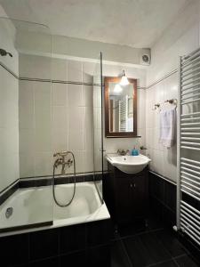 a bathroom with a tub and a sink and a shower at Aroma Piliou - Άρωμα Πηλίου in Mouresi +35 photos
