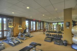 a gym with lots of exercise equipment in a building at Steps to Gondola – Elevate Townhome at Wildhorse Meadows in Steamboat Springs