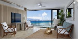 a living room with a view of the ocean at Unforgettable Oceanfront Stay , Nature, Luxury & Tranquility in Kahana