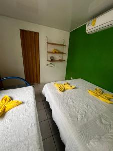 Ένα ή περισσότερα κρεβάτια σε δωμάτιο στο Cabinas Golfito