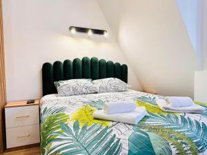 Ένα ή περισσότερα κρεβάτια σε δωμάτιο στο Lexi Green Hills apartman