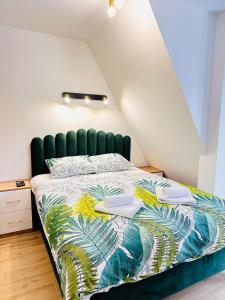 Postel nebo postele na pokoji v ubytování Lexi Green Hills apartman