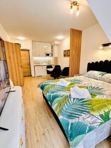 Ένα ή περισσότερα κρεβάτια σε δωμάτιο στο Lexi Green Hills apartman