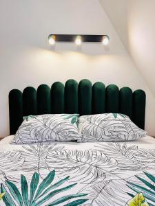 Ένα ή περισσότερα κρεβάτια σε δωμάτιο στο Lexi Green Hills apartman