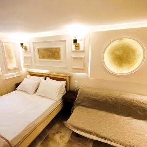 a small bedroom with a bed and a window at Villa Miltiadis GreeceFiloxenia in Volos
