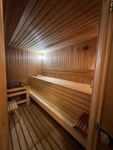 a small wooden sauna with a bench in it at Кемпинг Мечта in Uralsk