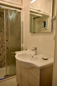 Koupelna v ubytování Matheria Home + 14 fotografií