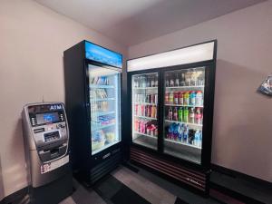 two soda machines are next to each other at Ramada by Wyndham Sparta/At Speedway in Sparta