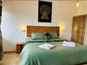 Voodi või voodid majutusasutuse The Bodhi Tree Resort toas