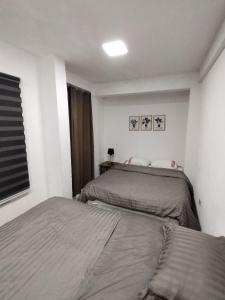 Ap 90 O´ H Apart客房内的一张或多张床位