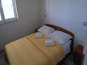 Postel nebo postele na pokoji v ubytování Apartments Marietta