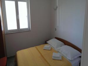 Postel nebo postele na pokoji v ubytování Apartments Marietta