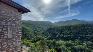 a view of a valley with mountains and trees at Cottanello,"La casa del sole" in Cottanello