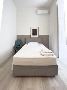A bed or beds in a room at b&b boutique suite bari