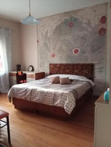 Postel nebo postele na pokoji v ubytování Kolhida home
