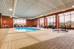 a large room with a swimming pool in a building at Drury Inn & Suites Springfield in Springfield