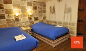 Una cama o camas en una habitación de Tambo Aymara 39 fotos más