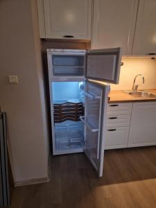 an empty refrigerator with its door open in a kitchen at studio, sunny fort, sunny beach in Sunny Beach