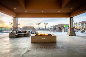 a large patio with a fire pit in the middle at Zion Getaway - Private Oasis w Pool Hot Tub & Game Room in Hurricane