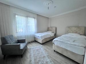Ένα ή περισσότερα κρεβάτια σε δωμάτιο στο Hamsiköy Lifora House