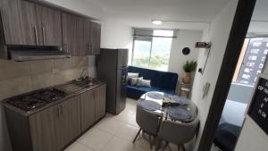 Kuchyň nebo kuchyňský kout v ubytování ApartaHoteles Armenia, Quindío