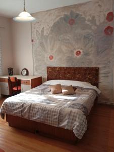 Postel nebo postele na pokoji v ubytování Kolhida home