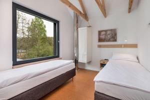 Ένα ή περισσότερα κρεβάτια σε δωμάτιο στο Holiday Home by Lake Wise ka with Sauna