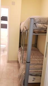 Giường trong phòng chung tại AMANECER De MAR