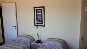 Giường trong phòng chung tại AMANECER De MAR +20 ảnh