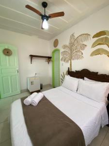 Postel nebo postele na pokoji v ubytování Casa Coco Verde Paraty