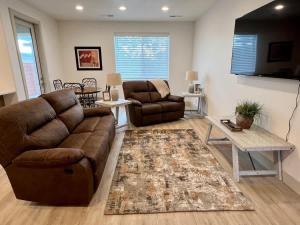 a living room with a couch and a table at Luxury Red Rock Townhome - 42- St George Santa Clara in Santa Clara +36 photos