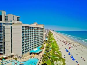 a hotel and a beach with people on it at Seas The Day - Stunning Ocean Views, Direct Beach Access, Prime Location! in Myrtle Beach