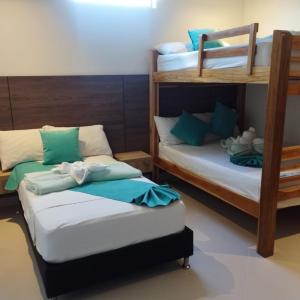 Postel nebo postele na pokoji v ubytování Hotel Luna Verde