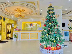 a christmas tree in the lobby of a store at Tuyet Son Hotel (TS Ocean Hotel) in Da Nang