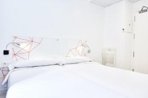 Postel nebo postele na pokoji v ubytování AMC Granada