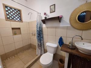 a bathroom with a toilet and a sink at Casa Lina sloth view exotic apartment with privat kitchen in Puerto Viejo +60 photos