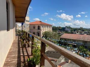 a balcony of a building with a view of a city at Jesuit Residence in Galle