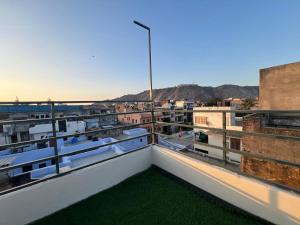 a view from the balcony of a building with grass at Rudra The Stay in Jaipur
