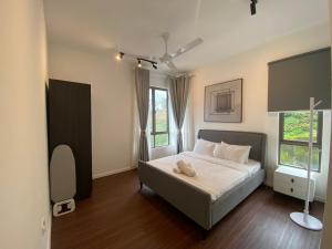 a bedroom with a bed and a window at PLAY at Palas Horizon @ Kea Farm in Cameron Highlands